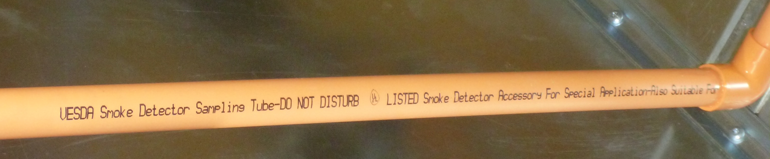 Closeup photo showing the required label on the HSSD sampling pipe
